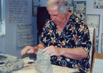 working with clay at Charter School, NYC